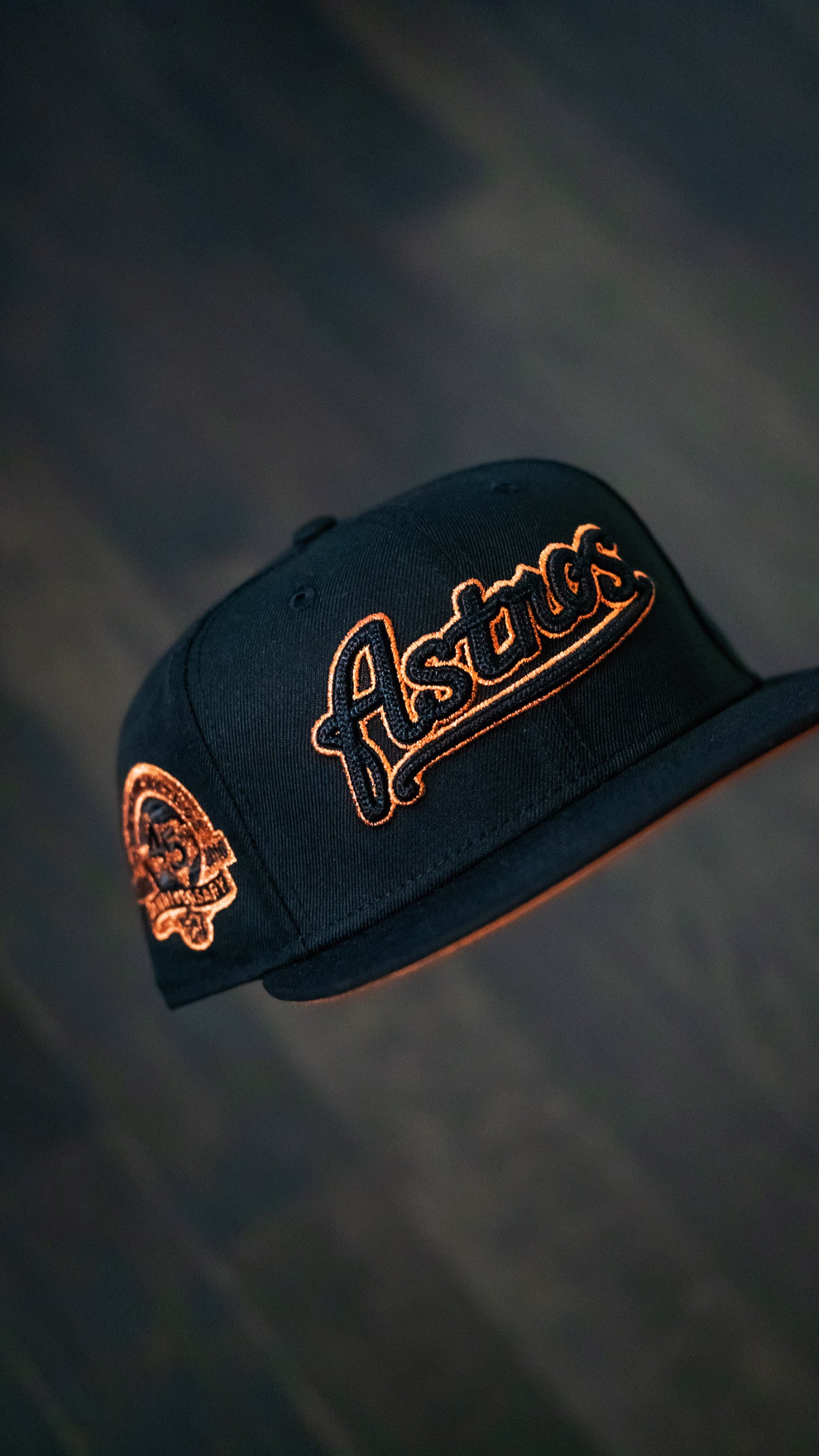 Black and burned orange Astros Script