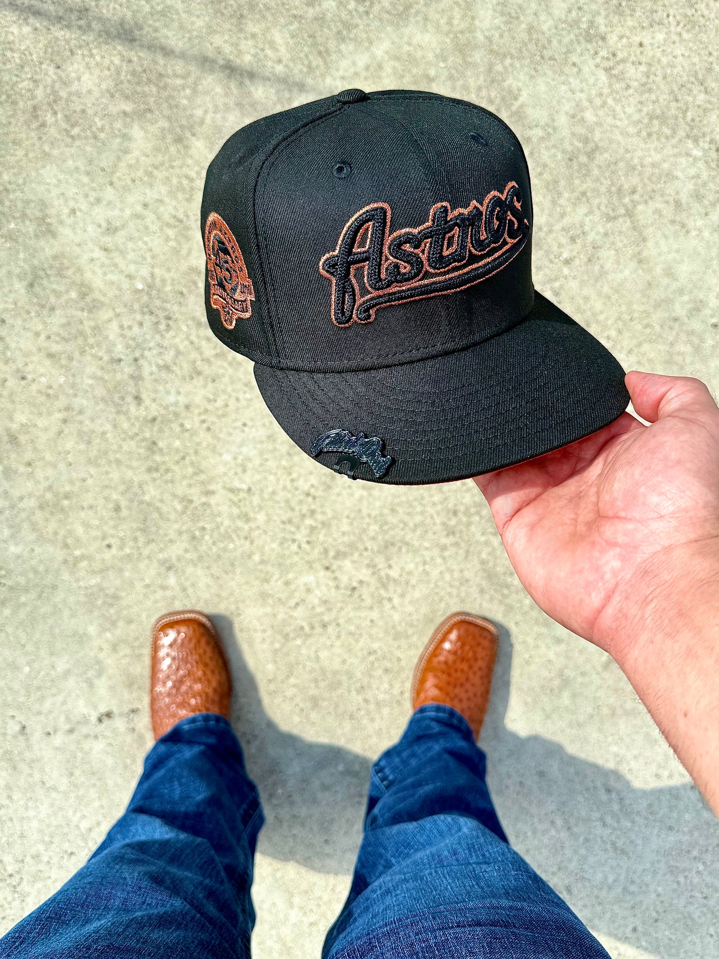 Black and burned orange Astros Script